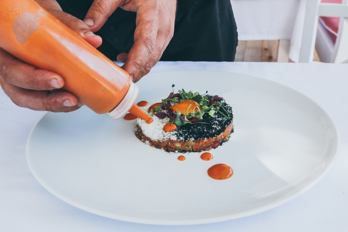 Sautéing vegetables in professional kitchen pan